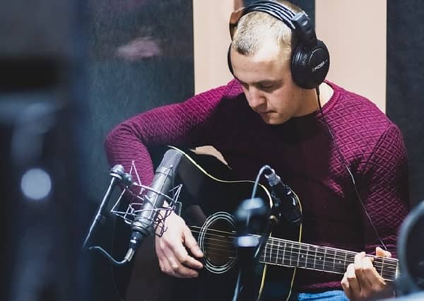 playing the guitar for recording