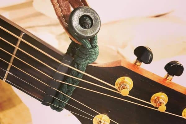 Tie the strap around the Headstock